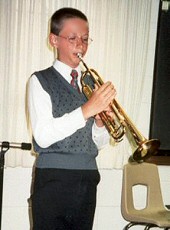 Photo of Andrew playing the trumpet