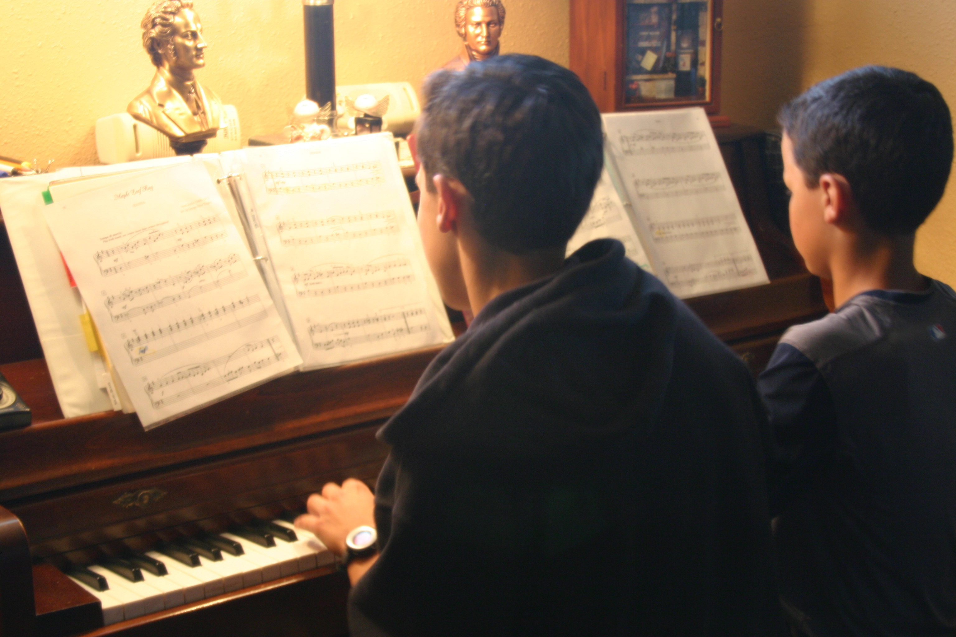 Thomas and Jordan play a duet during lessons