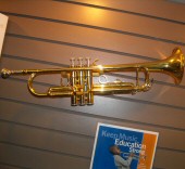 Photo of a trumpet on the wall in a store