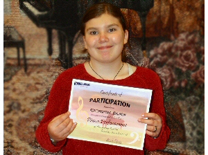 Photo of student holding participation certificate