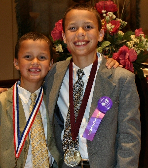 photo of 2 students wearing Medal of Distinction