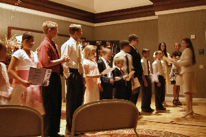 Photo of students receiving certificates at Recital